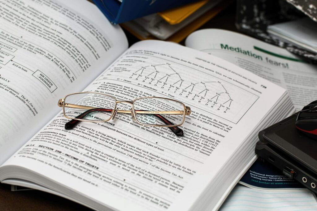 eyeglasses on an opened book